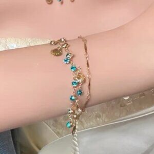 🍏50% OFF/3+...Dainty Bracelet with Gold Seashells and Blue Crystals.
